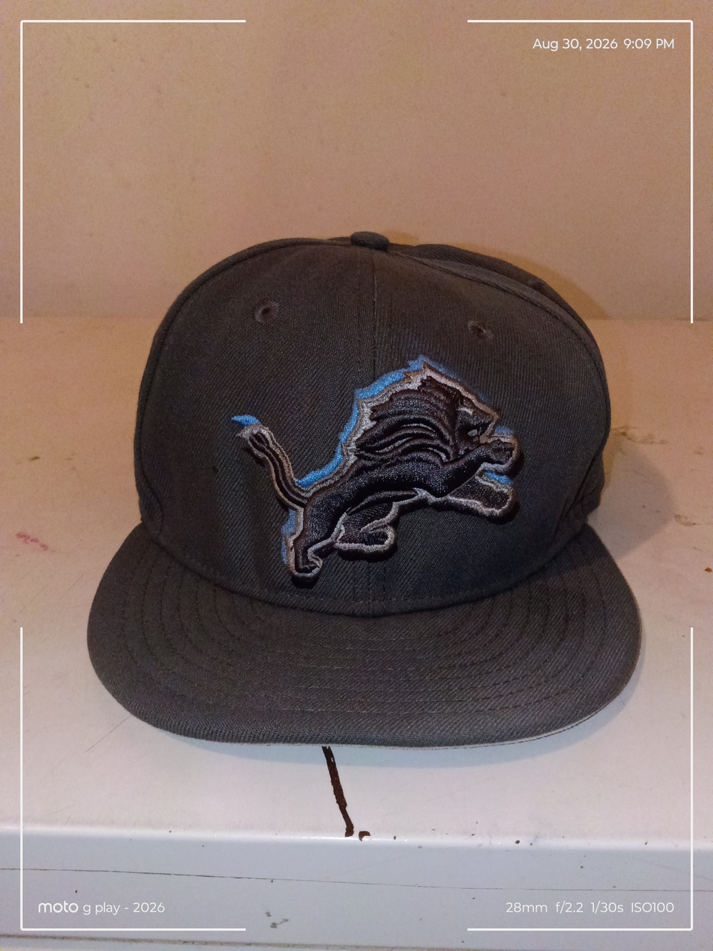 New Era Gray Snapback Cap with Embroidered Black & Light Blue Lion